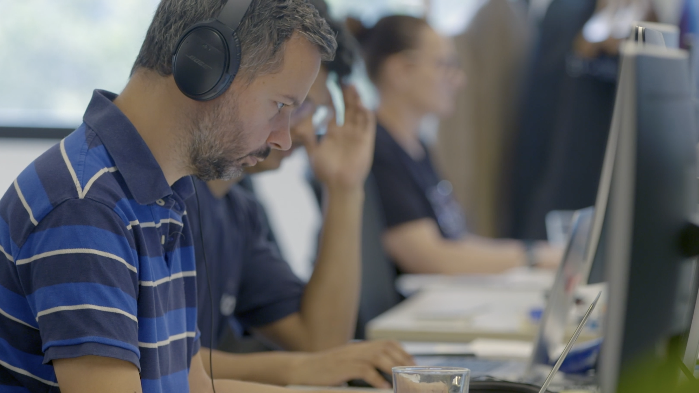 Team member working at computer on the home loans platform